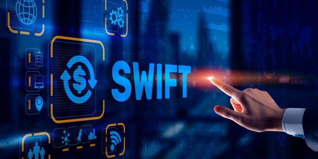 SWIFT logo integrated with a tokenization system, representing CBDC stock and decentralized networks.